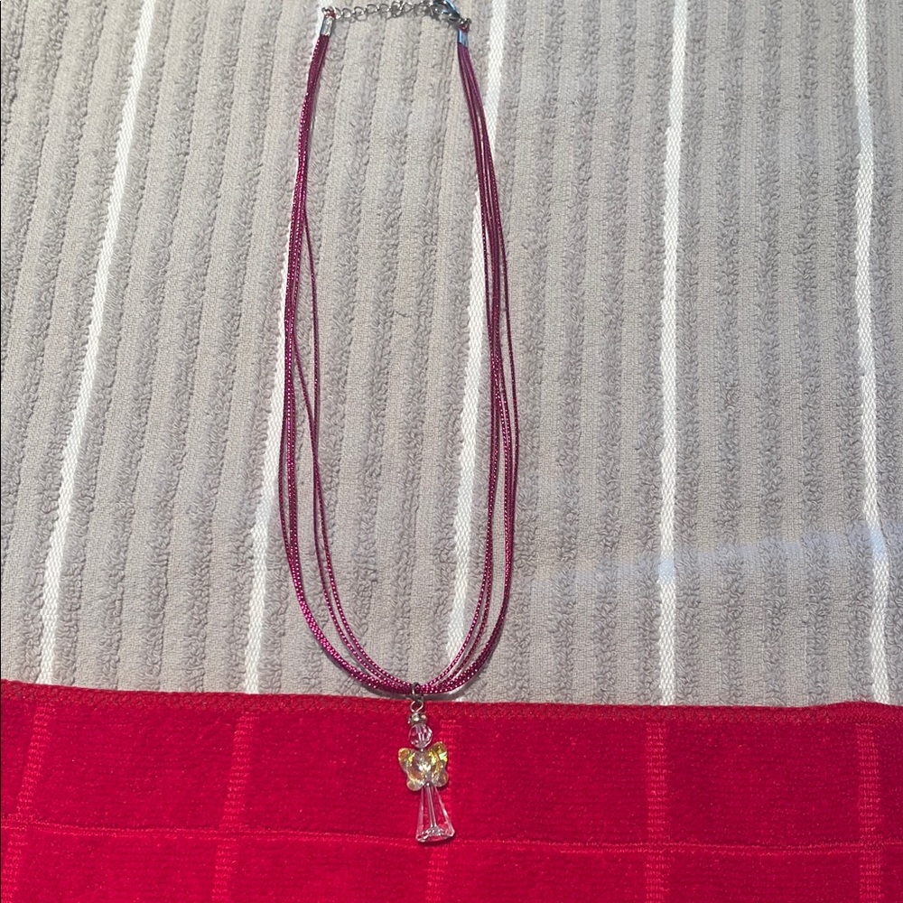 Beautiful Swarovski angel necklace, NWOT, 16” cord
